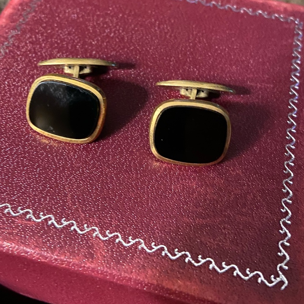 Black and gold cuff links.